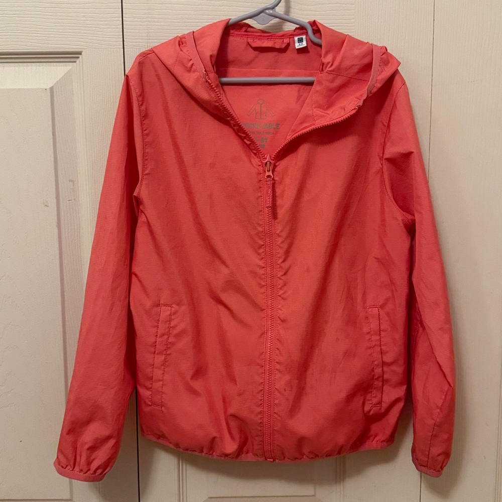 Uniqlo girls packable lightweight Jacket in Coral size 7-8Y